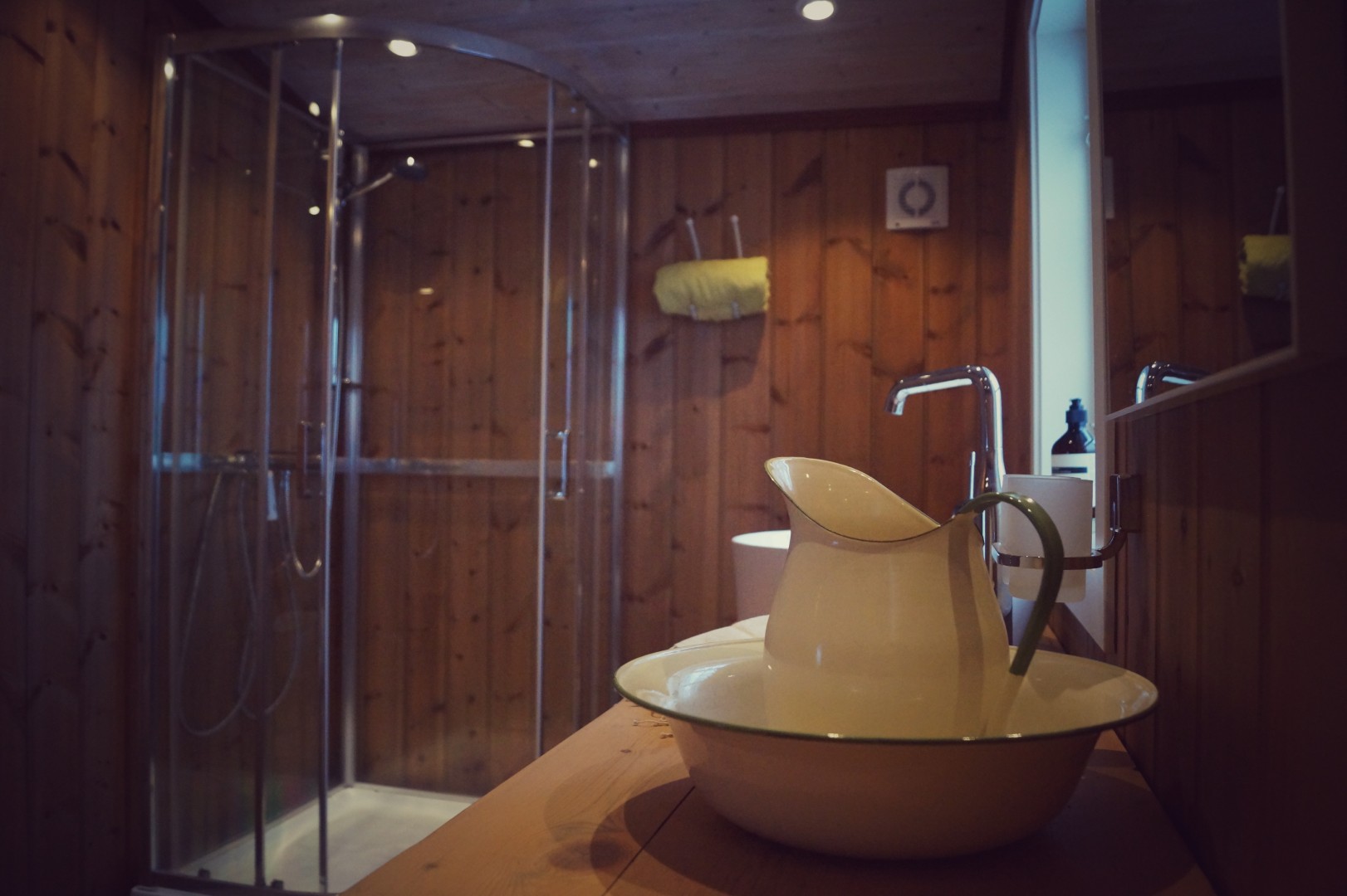 Shower cubicle behind vintage sink